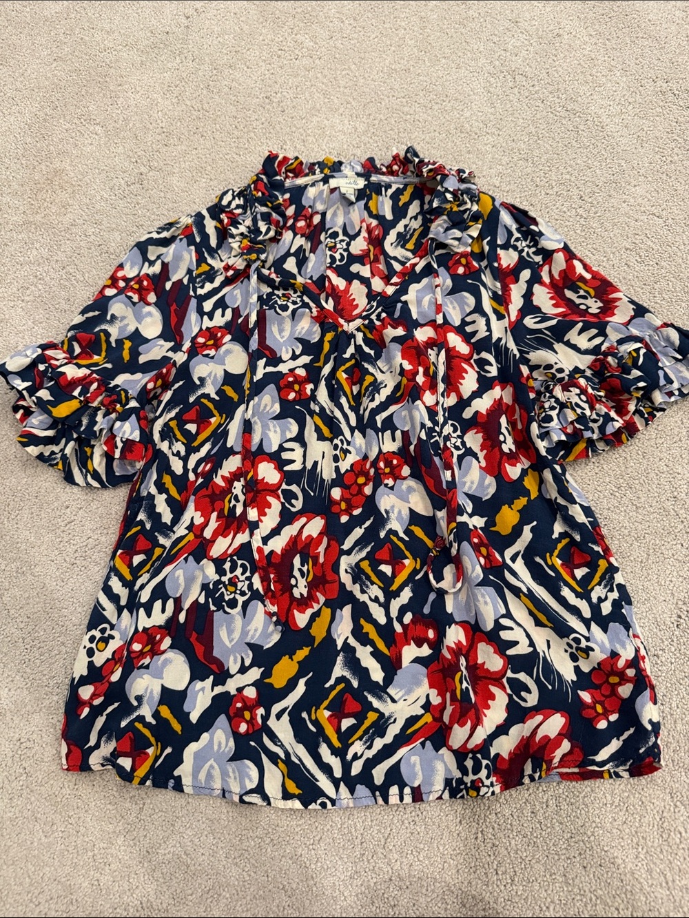 Odille Navy Floral Ruffle V-Neck Blouse with Red and Yellow Accents